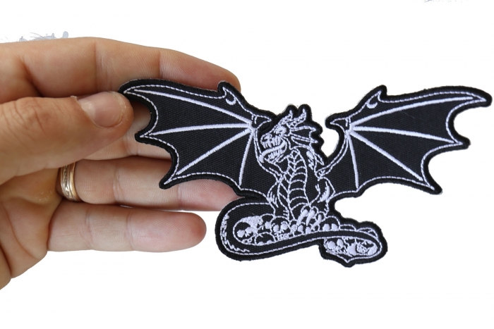 Dragon with Skulls Patch, Skull Patches shown on hand for size comparison