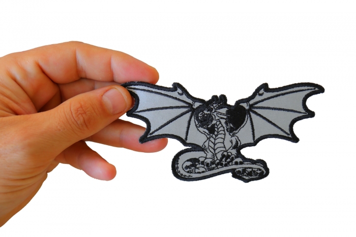 Dragon with Skulls Reflective Patch , Skull Patches shown on hand for size comparison