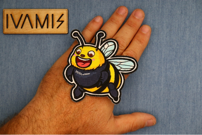Fat Bee Patch shown on hand for size comparison
