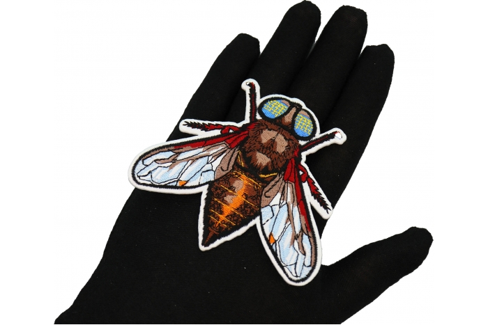 Fly Patch shown on hand for size comparison
