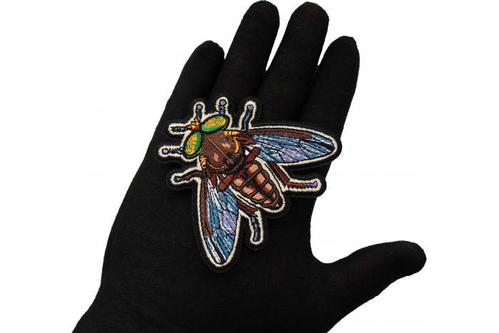 Fly Patch shown on hand for size comparison
