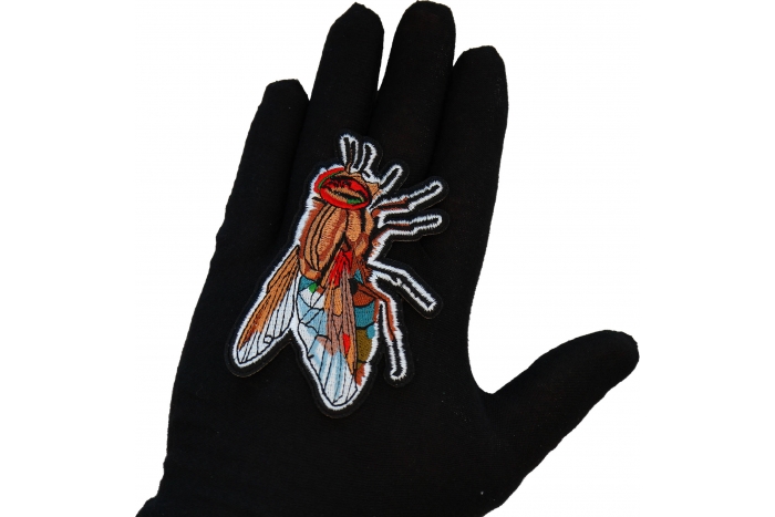 Fly Patch shown on hand for size comparison