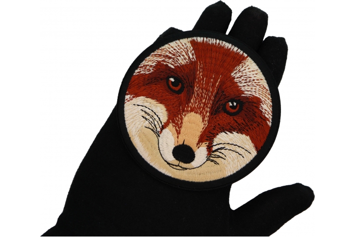 Fox Stare Round Patch shown on hand for size comparison