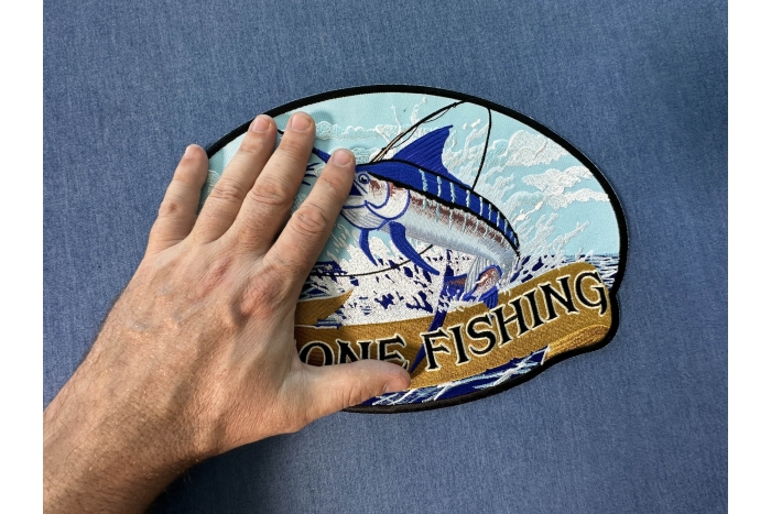 Gone Fishing Marlin Patch, Large Animal Patches for Jackets shown on hand for size comparison