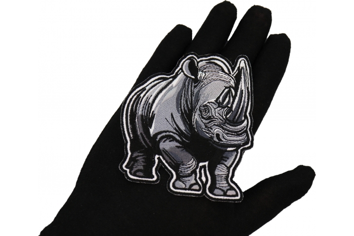 Gray Rhino Patch shown on hand for size comparison