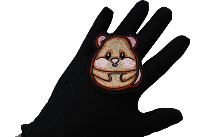 Hamster Iron on Patch shown on hand for size comparison