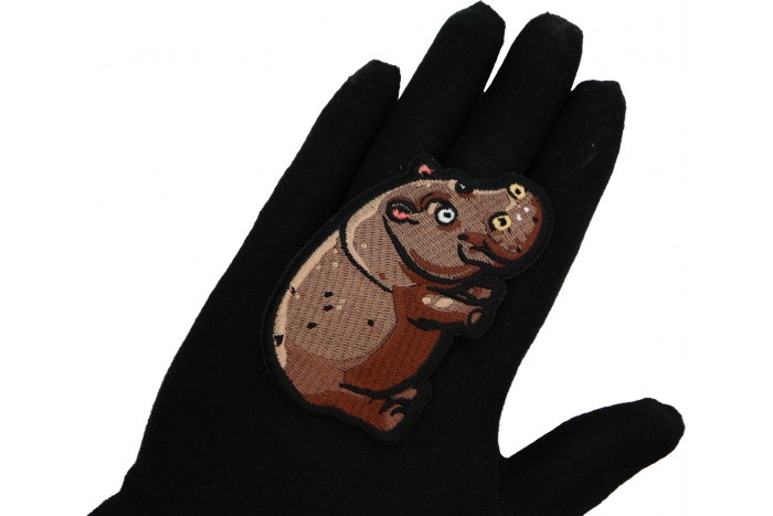 Hippo Patch shown on hand for size comparison