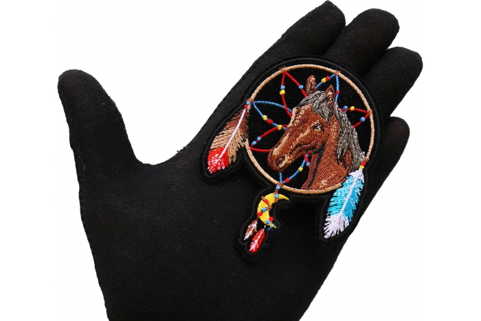 Horse in Dreamcatcher Iron on Patch shown on hand for size comparison