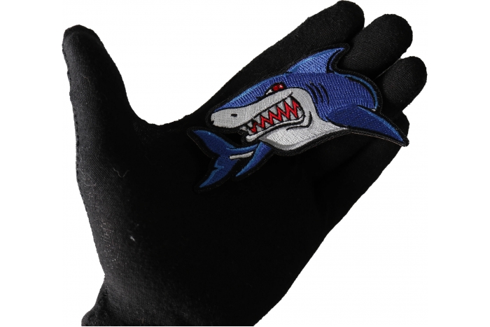 Iron on Shark Patch shown on hand for size comparison