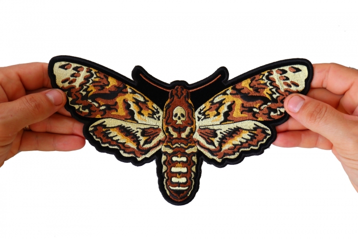 Skull Moth Patch, Large Animal Patches for Jackets shown on hand for size comparison