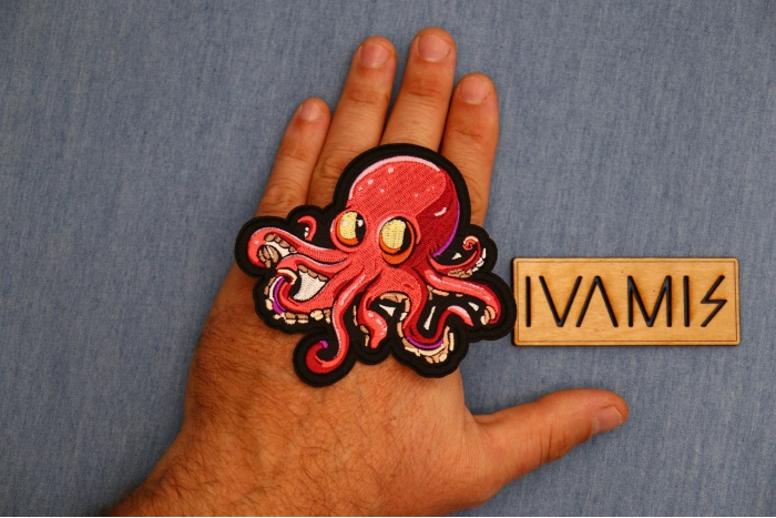 Octopus Patch shown on hand for size comparison