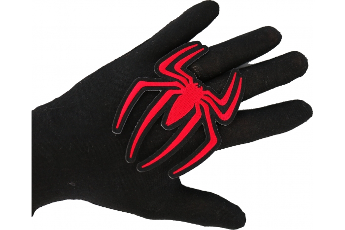 Red Spider Patch shown on hand for size comparison