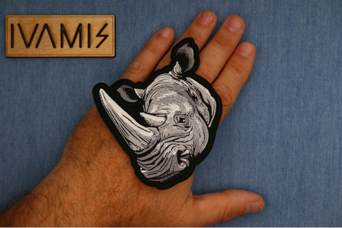Rhino Patch shown on hand for size comparison