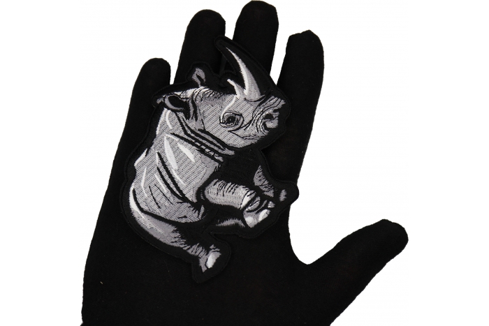 Rhino Patch shown on hand for size comparison