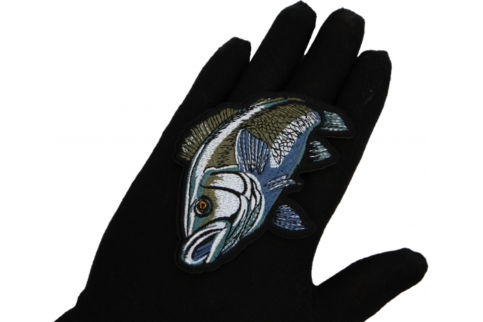 Sea Bass Fish Patch shown on hand for size comparison