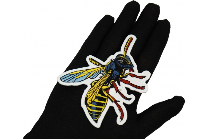 Wasp Patch shown on hand for size comparison