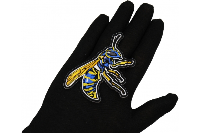Wasp Patch shown on hand for size comparison