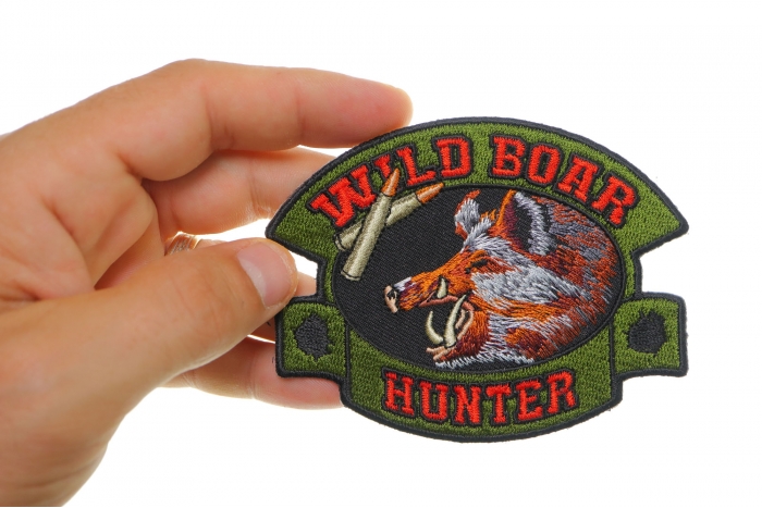 Wild Boar Hunter Patch shown on hand for size comparison