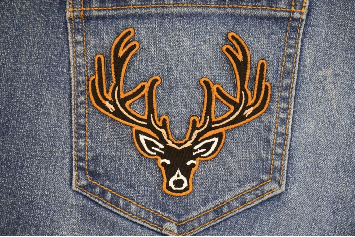 Black Deer Head Patch shown on jeans