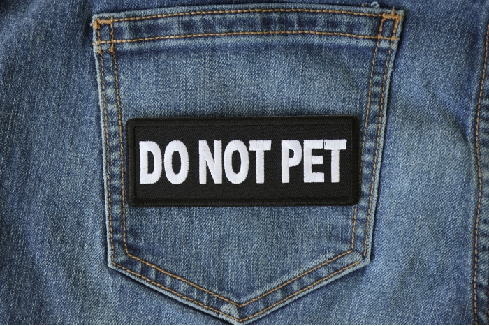 Do Not Pet Patch shown on jeans