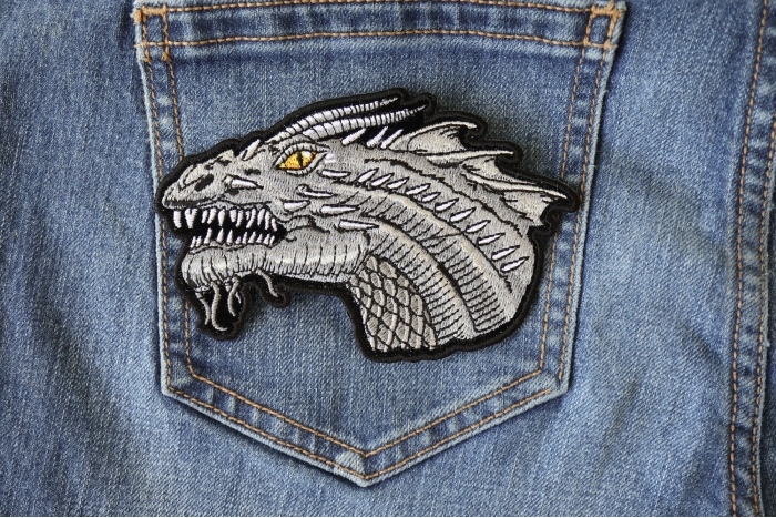 Dragon Patch Small with Yellow Eyes shown on jeans