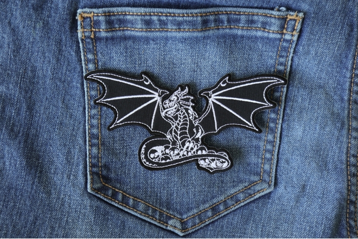 Dragon with Skulls Patch shown on jeans