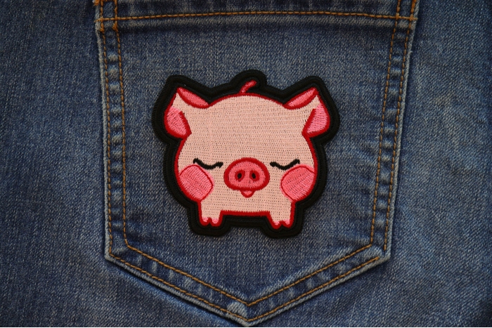 Kiss Me Piggy Iron on Patch shown on jeans
