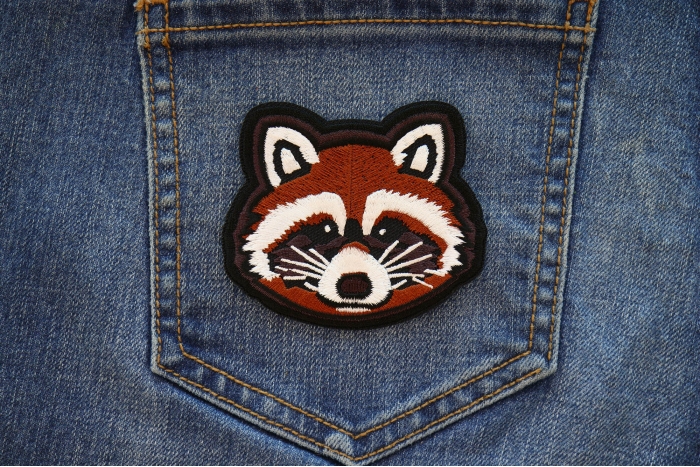 Raccoon Iron on Patch shown on jeans