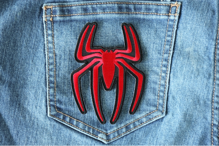 Red Spider Patch shown on jeans