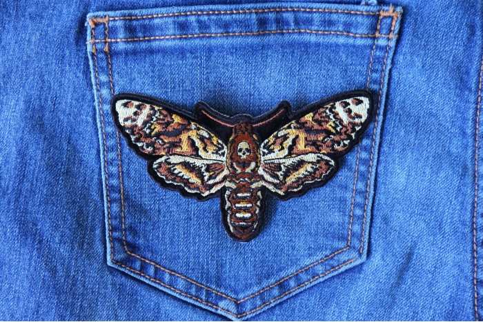 Moth Skull Patch shown on jeans