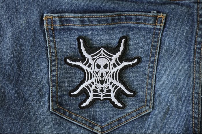 Spider Skull Iron on Patch shown on jeans