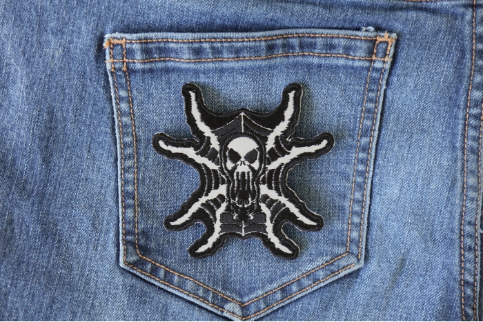 Spider Skull Reflective Iron on Patch shown on jeans