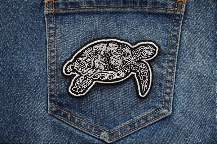 Tribal Turtle Patch shown on jeans