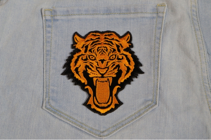 Vicious Tiger Patch Small In Orange shown on jeans