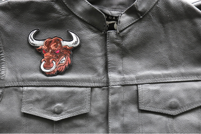 Angry Bull Iron on Patch - 4x3.75 inch - Embroidered Iron on Patch shown on leather vest