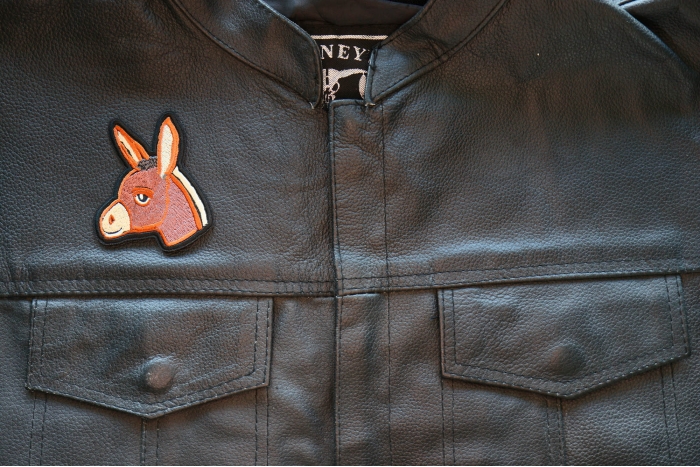Baby Donkey Iron on Patch shown on leather vest