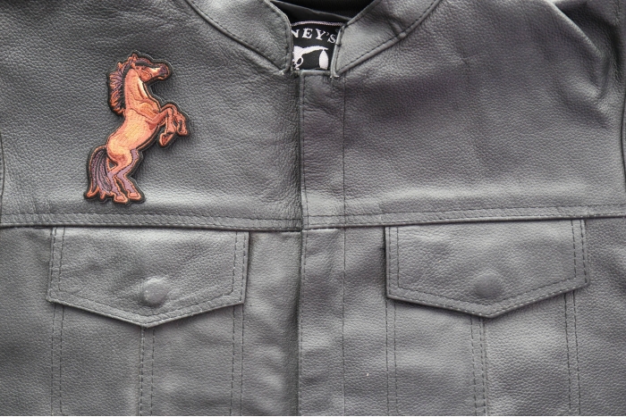 Brown Horse Patch shown on leather vest