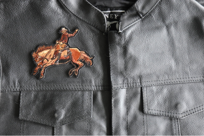 Cowboy Horse Patch - 4.5x3.5 inch - Embroidered Iron on Patch shown on leather vest