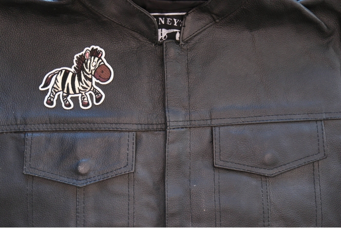 Cartoon Zebra Patch shown on leather vest