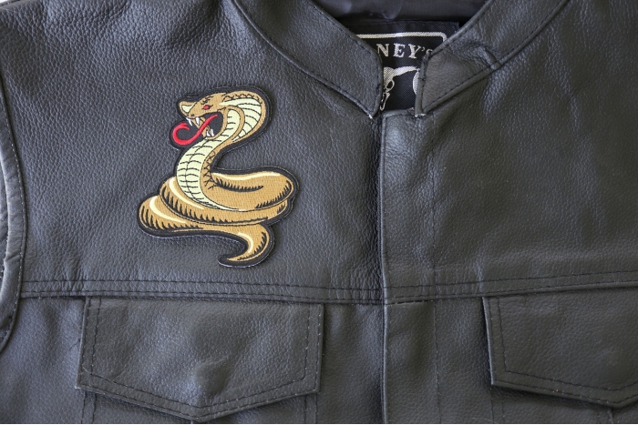 Cobra Patch - 3.5x4 inch. Embroidered Iron on Patch shown on leather vest