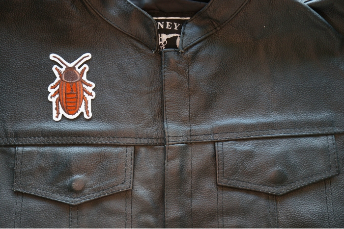 Cockroach Iron on Patch shown on leather vest