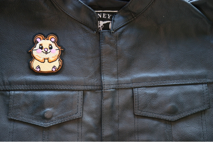 Cute Hamster Iron on Patch shown on leather vest