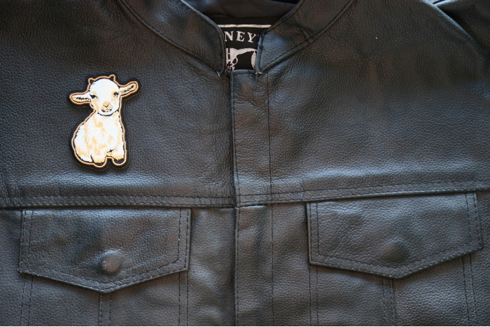 Cutey Lamb Iron on Patch shown on leather vest