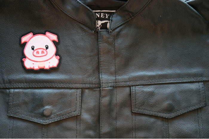 Fat Pig Iron on Patch shown on leather vest
