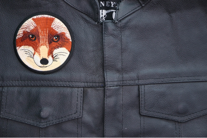 Fox Stare Round Patch shown on leather vest