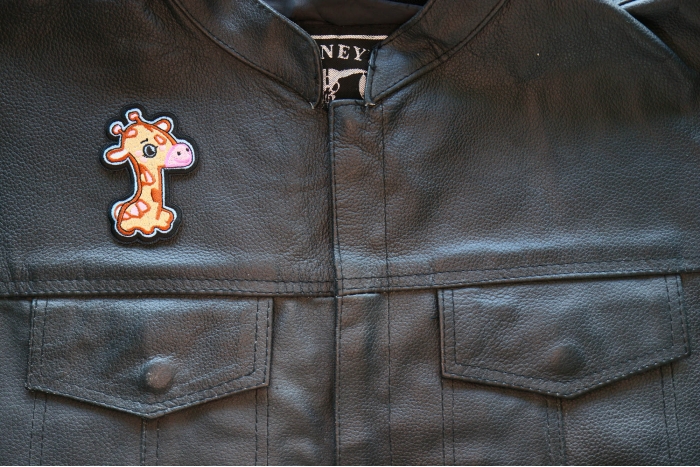 Giraffe Iron on Patch shown on leather vest