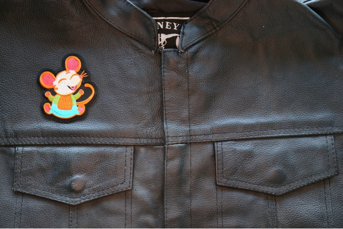 Happy Rat Iron on Patch shown on leather vest