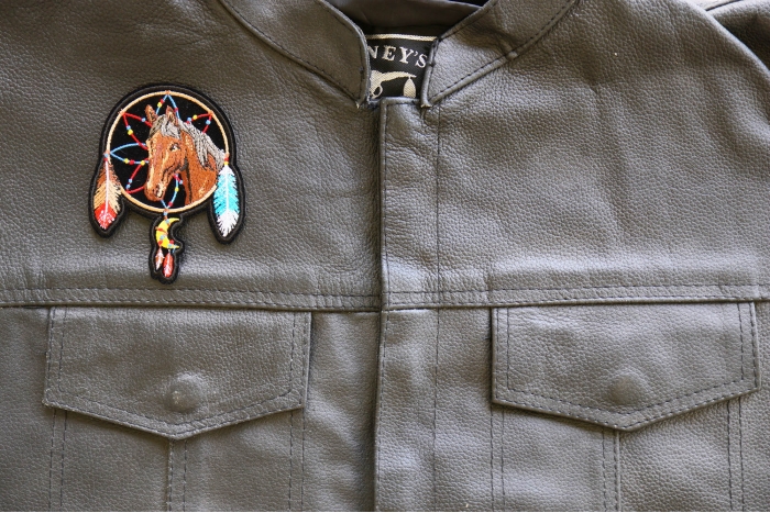 Horse in Dreamcatcher Iron on Patch shown on leather vest