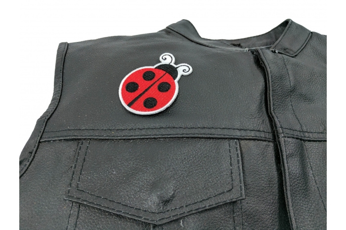 Lady Bug Iron On Patch - 3x2.3 inch. Embroidered Iron on Patch shown on leather vest