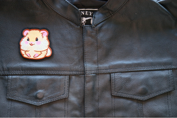 Lady Hamster Iron on Patch shown on leather vest